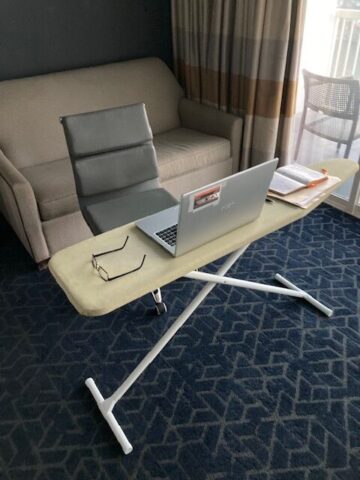 Home office setup with ironing board as a desk